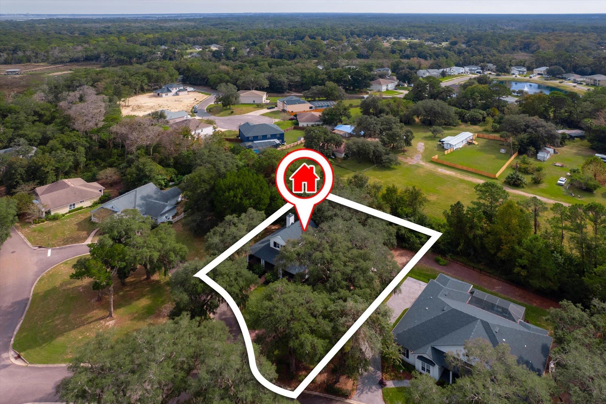 29318 Grandview Manor Yulee, FL 32097 - Photo 46 of 68 Aerial view of property's location with property boundaries highlighted and nearby suburban area