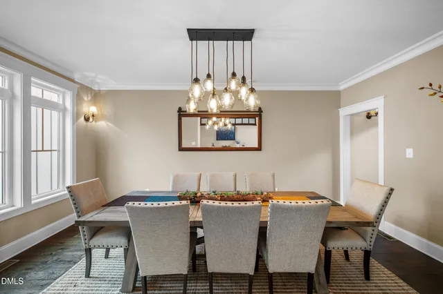 a large kitchen with lots of counter space a sink appliances and living room view