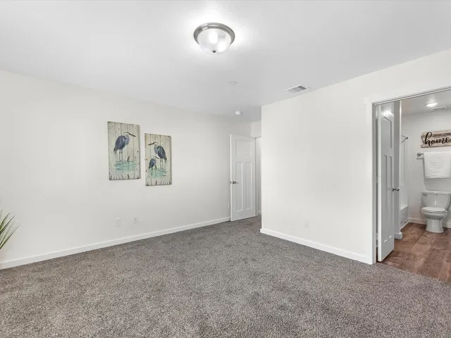 an empty room with a bathroom