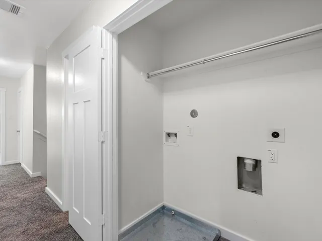 a bathroom with a shower and a sink