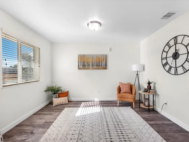 a bedroom with furniture and a window