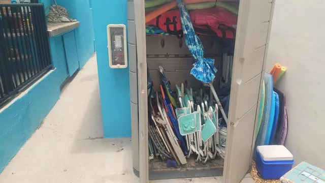 a view of a chairs and table in a backyard