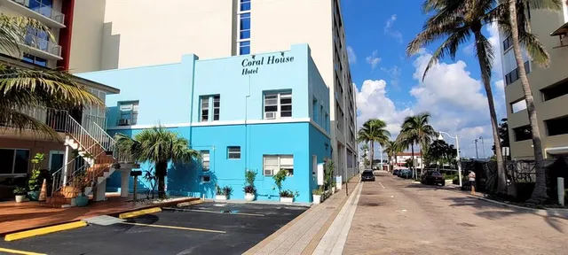 a front view of a building with street view