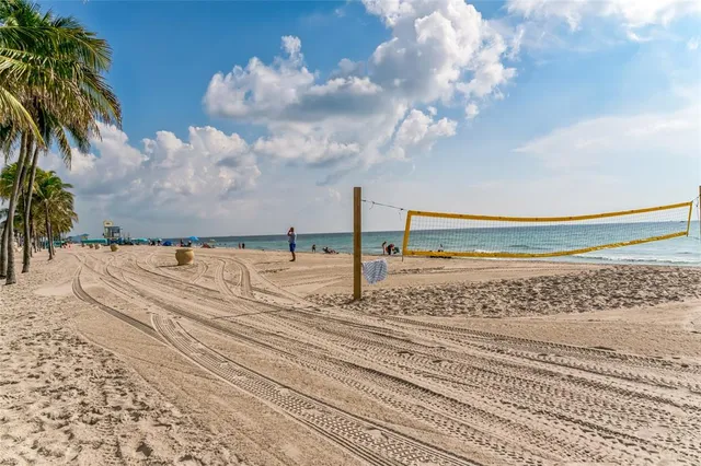 a view of street with palm trees