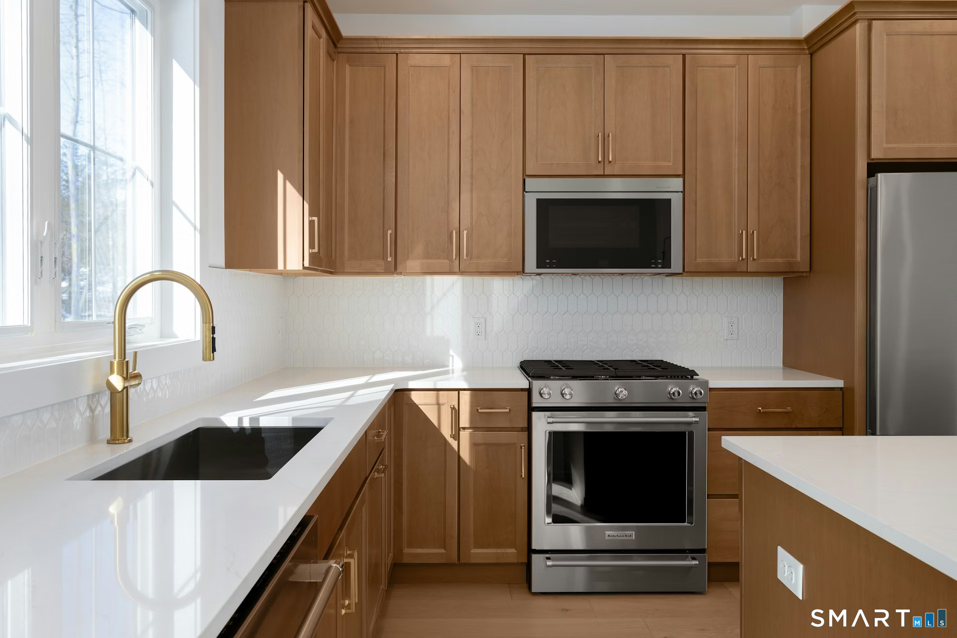 27 Bramble Way Brookfield, CT 06804 - Photo 5 of 26 a kitchen with a sink and a stove top oven