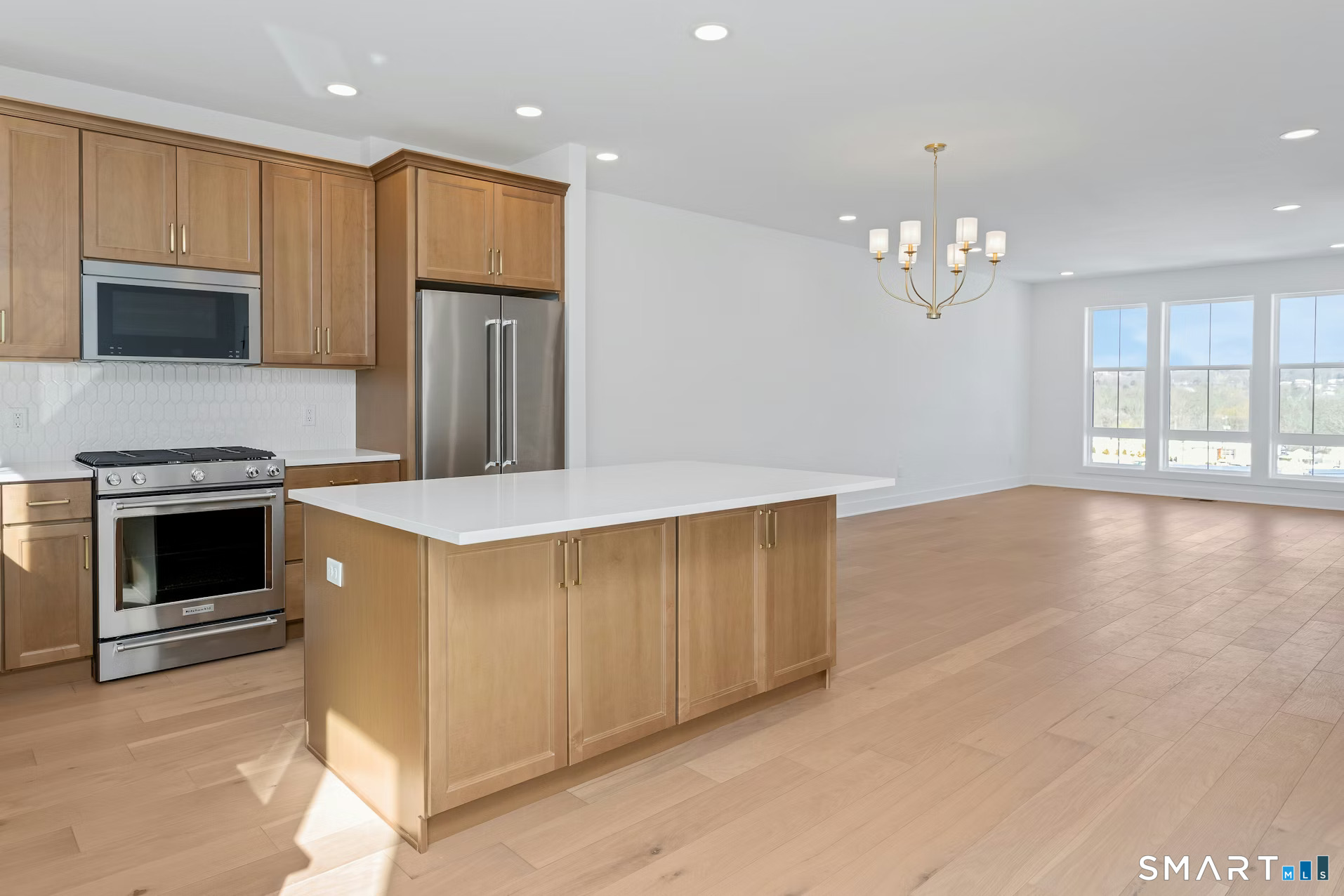 27 Bramble Way Brookfield, CT 06804 - Photo 6 of 26 a kitchen with granite countertop stainless steel appliances and wooden cabinets