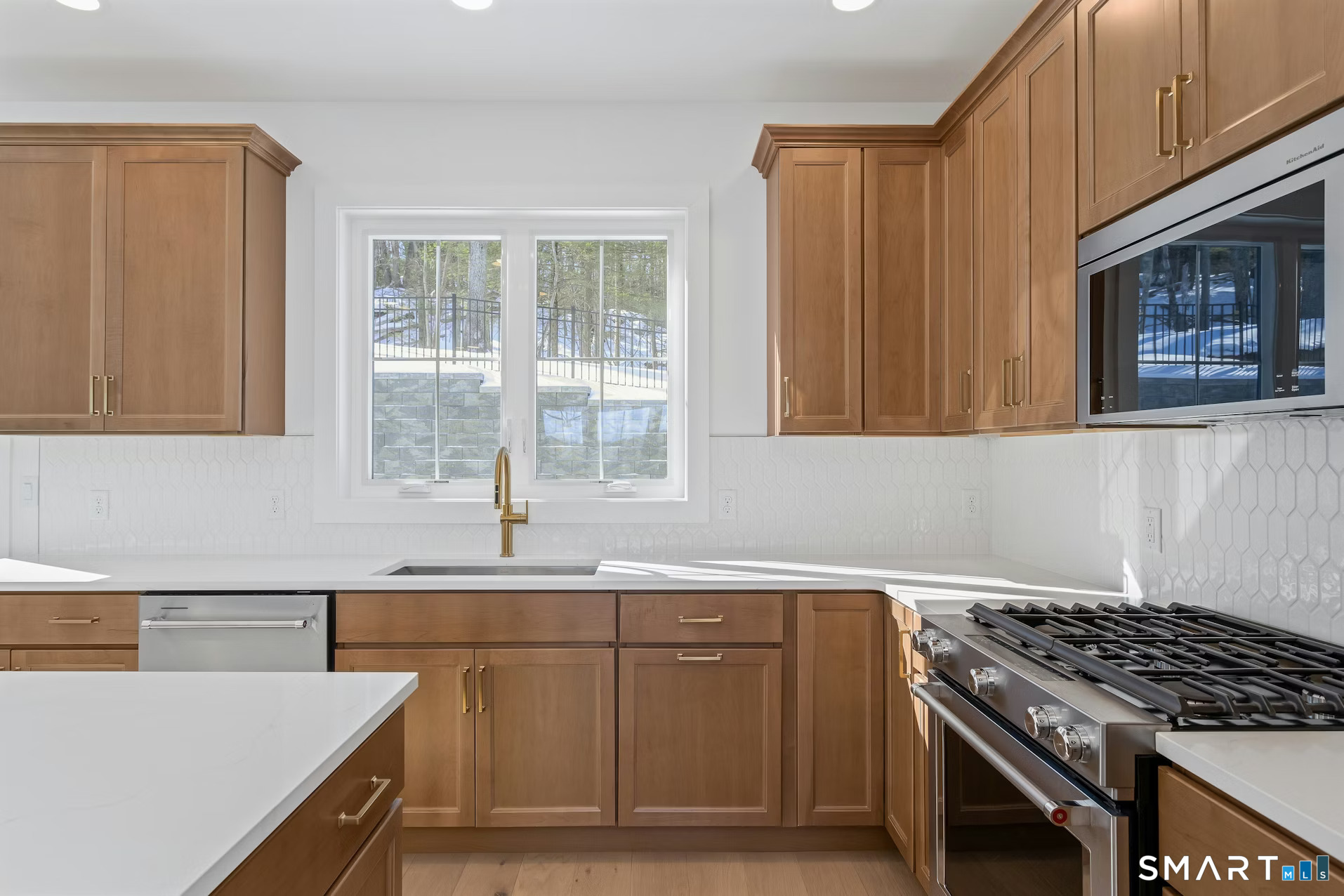 27 Bramble Way Brookfield, CT 06804 - Photo 7 of 26 a kitchen with stainless steel appliances granite countertop a sink stove and cabinets