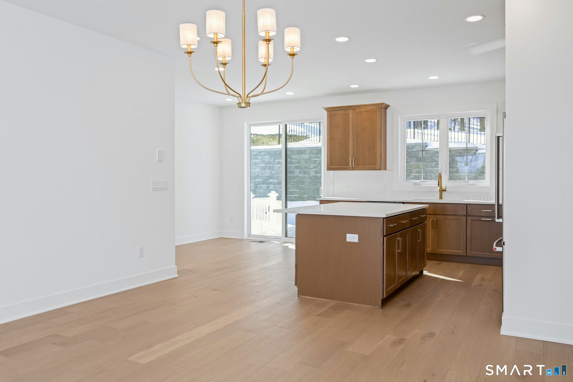 27 Bramble Way Brookfield, CT 06804 - Photo 8 of 26 a living room with stainless steel appliances kitchen island granite countertop furniture and a large window