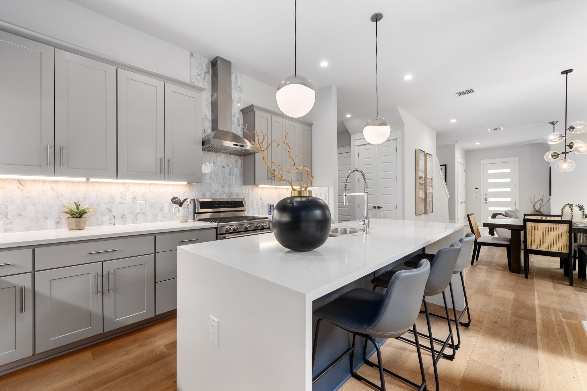 1409 Alegria Road, Unit A Austin, TX 78757 - Photo 10 of 24 Culinary delights await in this modern kitchen with sleek appliances and a spacious island.
