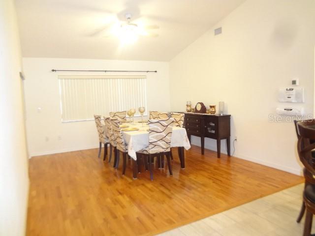 124 Foster Lane Palm Coast, FL 32137 - Photo 8 of 23 a view of a dining room with furniture