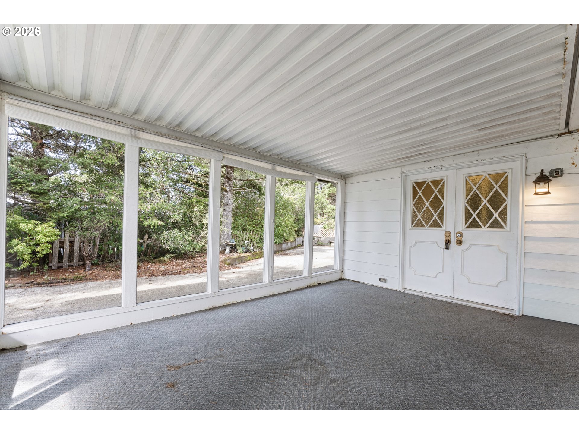 1600 Rhododendron Drive, Unit 415 Florence, OR 97439 - Photo 11 of 29 a view of empty room with floor to ceiling window