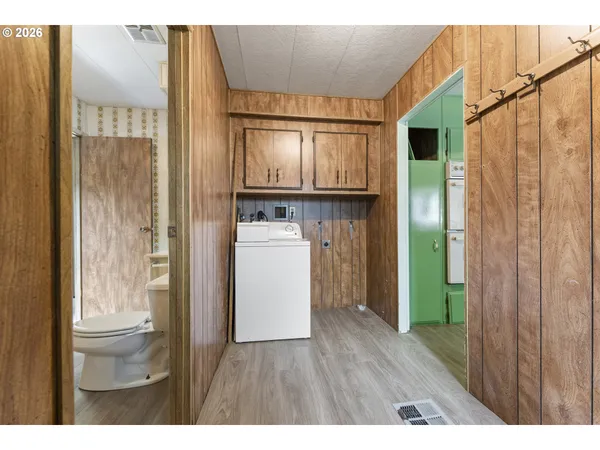a view of hallway with washer and dryer