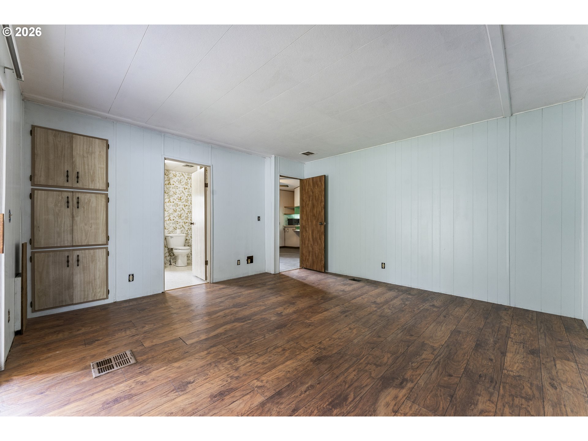 1600 Rhododendron Drive, Unit 415 Florence, OR 97439 - Photo 7 of 29 a view of an empty room with cabinet and entryway