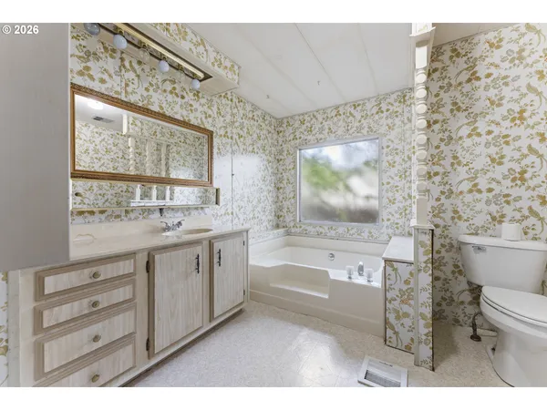 a bathroom with a sink a toilet and a bathtub