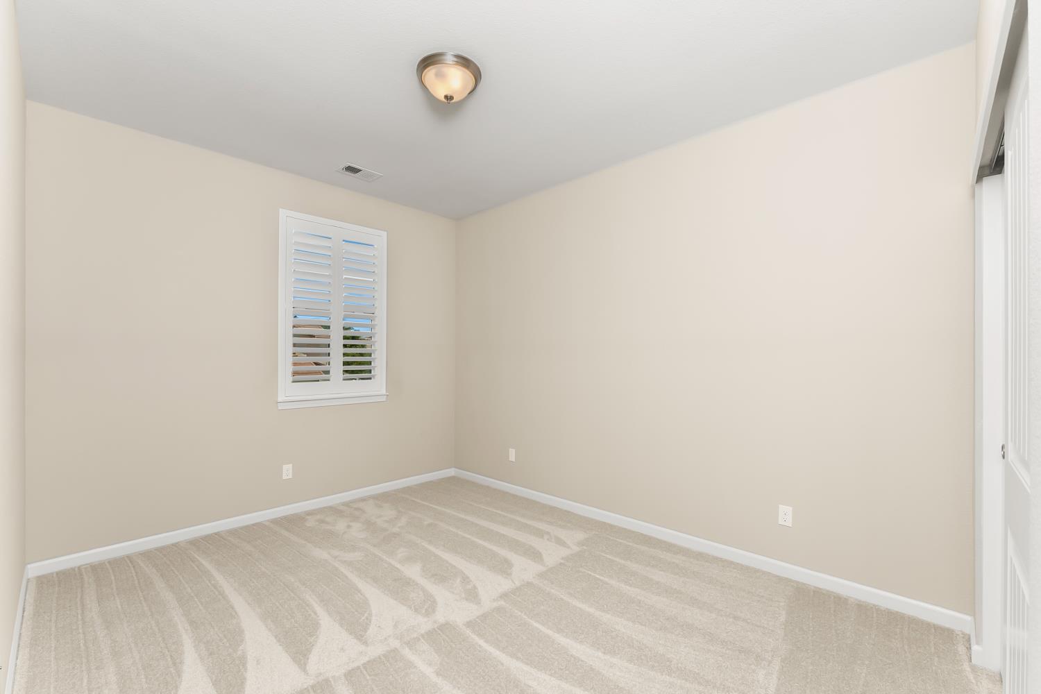 5453 Mossy Stone Way Rancho Cordova, CA 95742 - Photo 51 of 81 an empty room with a window