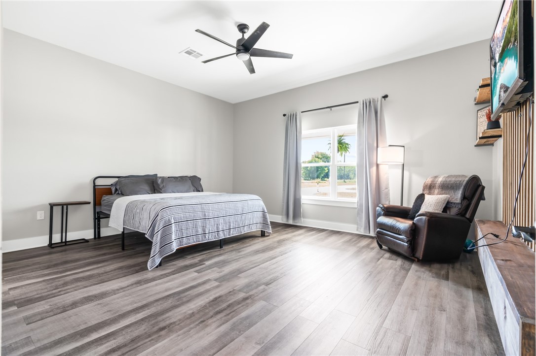 1589 Culpepper Lane China Spring, TX 76633 - Photo 15 of 48 a bedroom with a bed a couch and a window