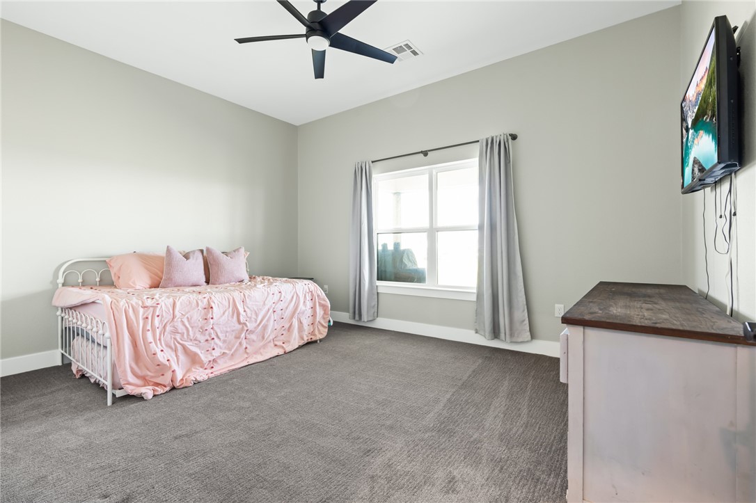 1589 Culpepper Lane China Spring, TX 76633 - Photo 21 of 48 a bedroom with a bed and a flat screen tv