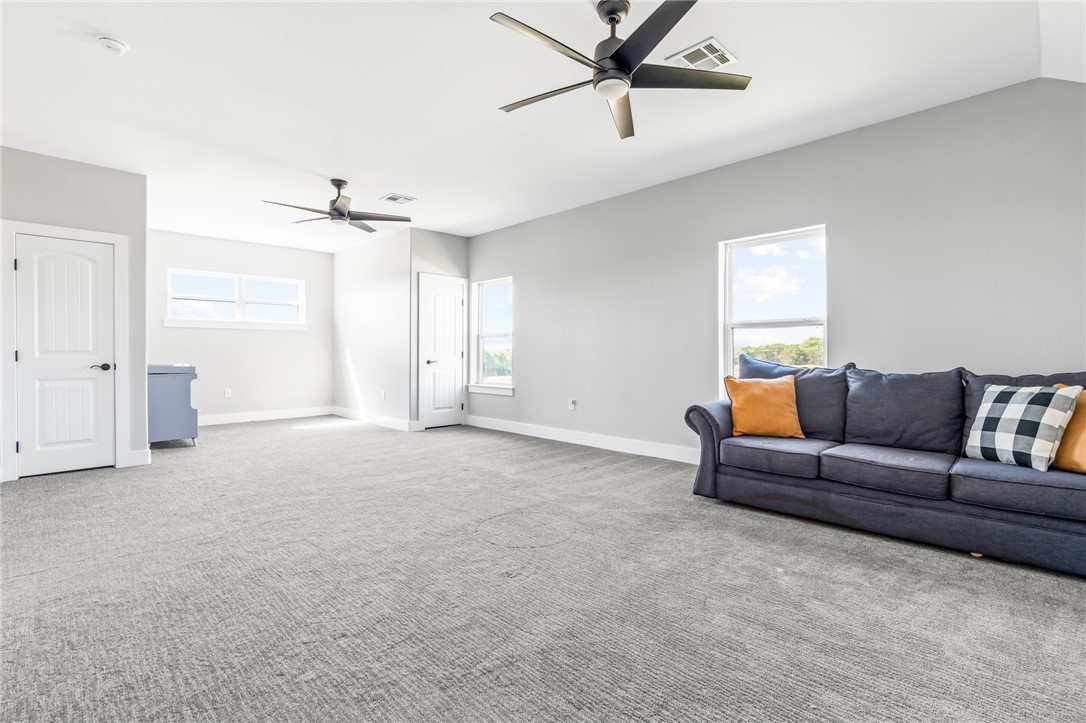 1589 Culpepper Lane China Spring, TX 76633 - Photo 27 of 48 a living room with furniture and a ceiling fan