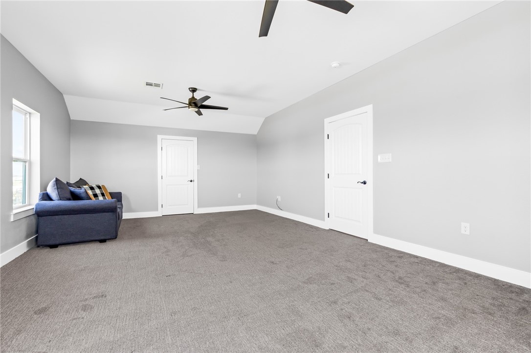 1589 Culpepper Lane China Spring, TX 76633 - Photo 28 of 48 an empty room with windows and ceiling fan