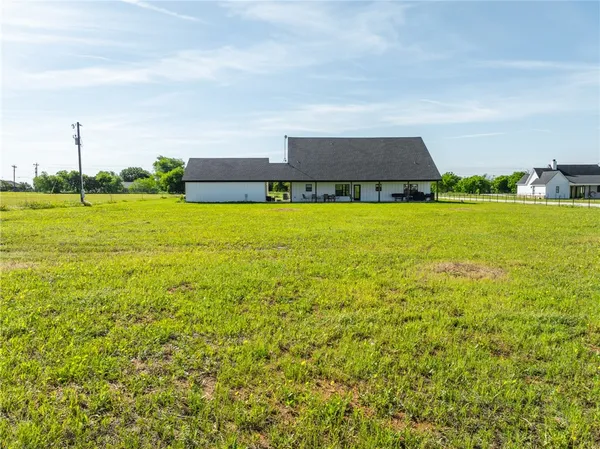 a view of a lake with a big yard
