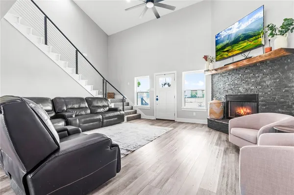 a living room with furniture and a fireplace