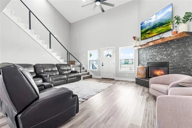 a living room with furniture and a fireplace