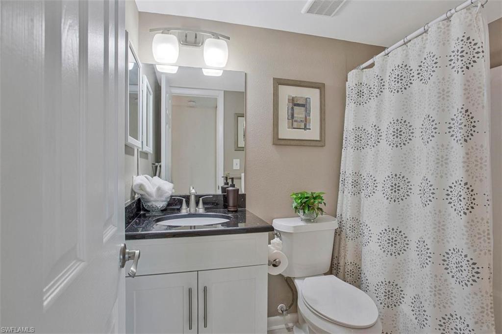 4258 27th Court Southwest, Unit 106 Naples, FL 34116 - Photo 10 of 19 Guest "suite" bath with tub and shower combo