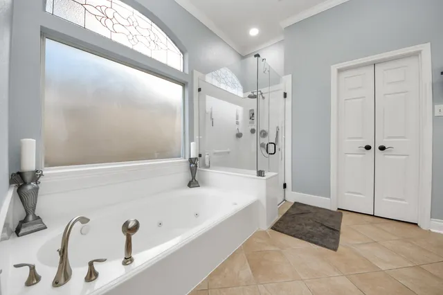 a bathroom with a bathtub and a shower