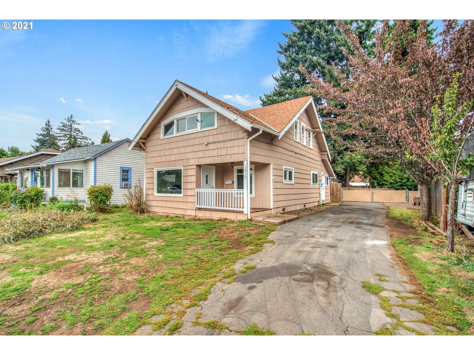 1215 2nd Street Northwest Salem, OR 97304 - Photo 2 of 32 a front view of a house with a yard