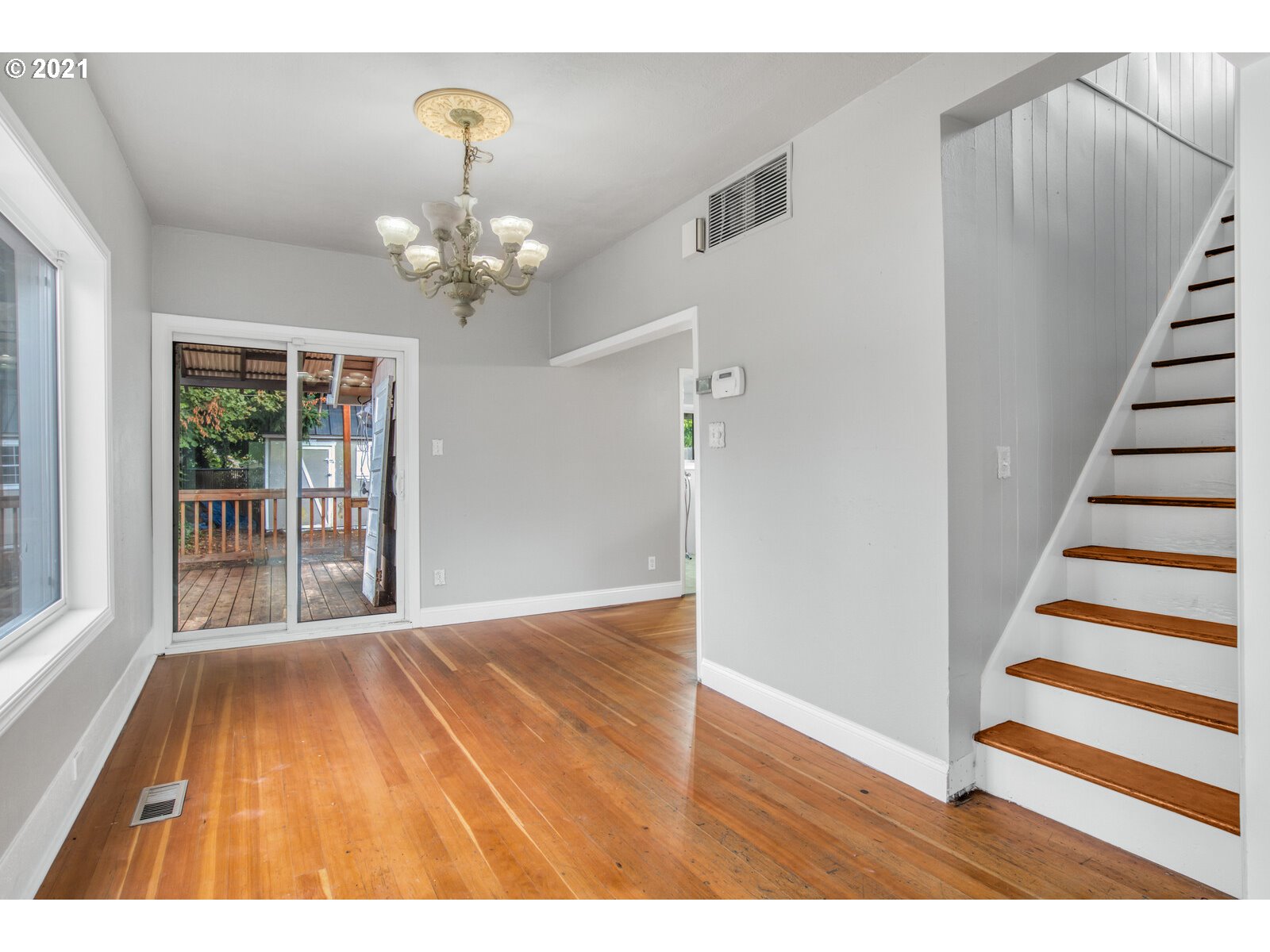 1215 2nd Street Northwest Salem, OR 97304 - Photo 11 of 32 a view interior of a house with wooden floor fan and windows