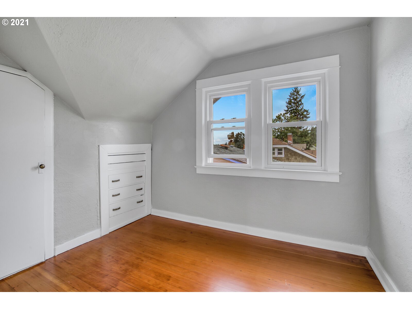 1215 2nd Street Northwest Salem, OR 97304 - Photo 19 of 32 view of room with window and hardwood floor