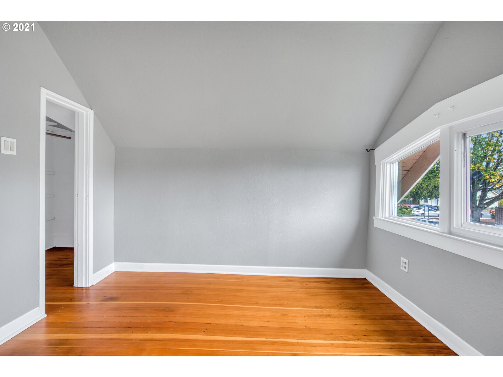 1215 2nd Street Northwest Salem, OR 97304 - Photo 21 of 32 a view of an empty room with wooden floor and a window