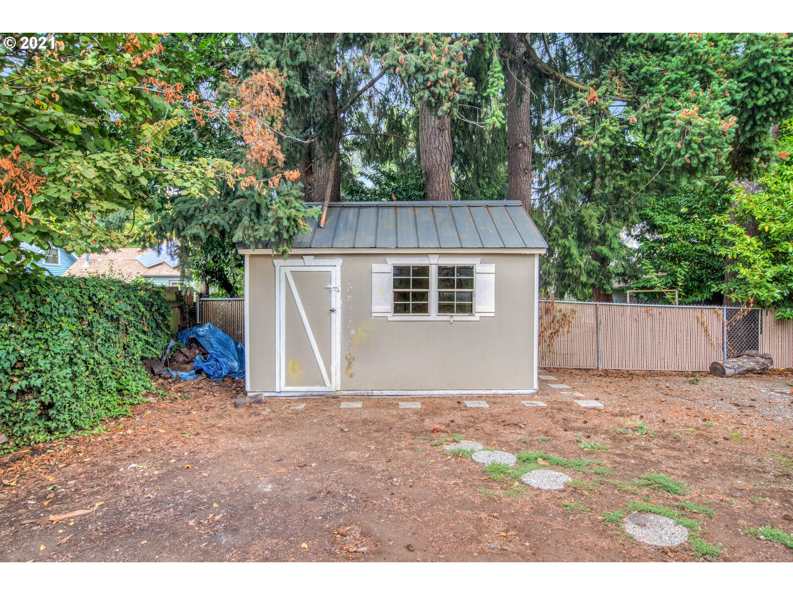 1215 2nd Street Northwest Salem, OR 97304 - Photo 28 of 32 a view of a small space in front of a house with a large tree