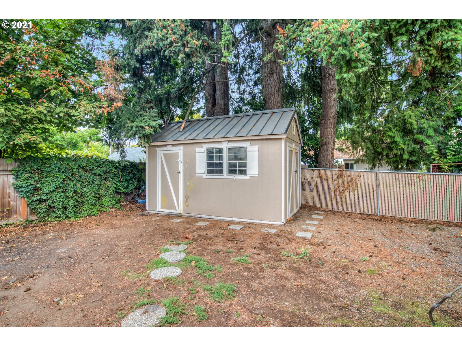 1215 2nd Street Northwest Salem, OR 97304 - Photo 29 of 32 a view of a house with a yard and garage
