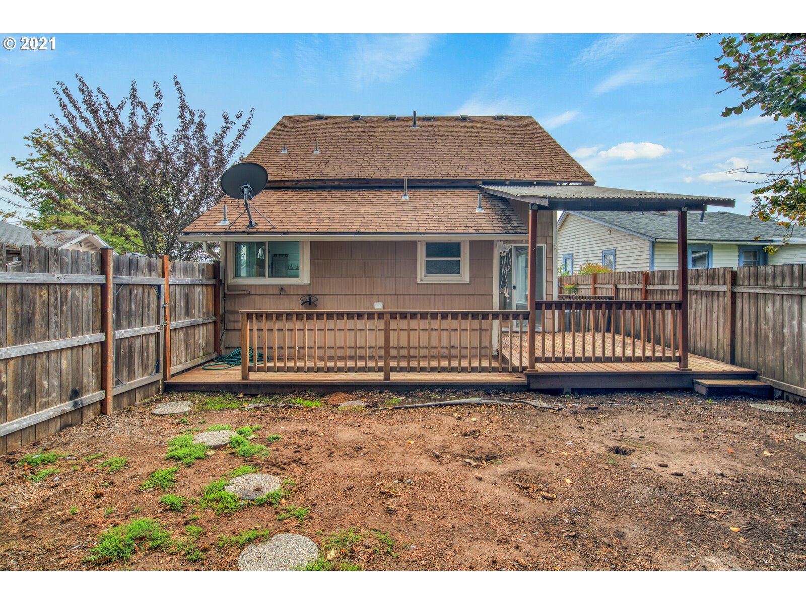 1215 2nd Street Northwest Salem, OR 97304 - Photo 30 of 32 a view of a house with a yard and a fence