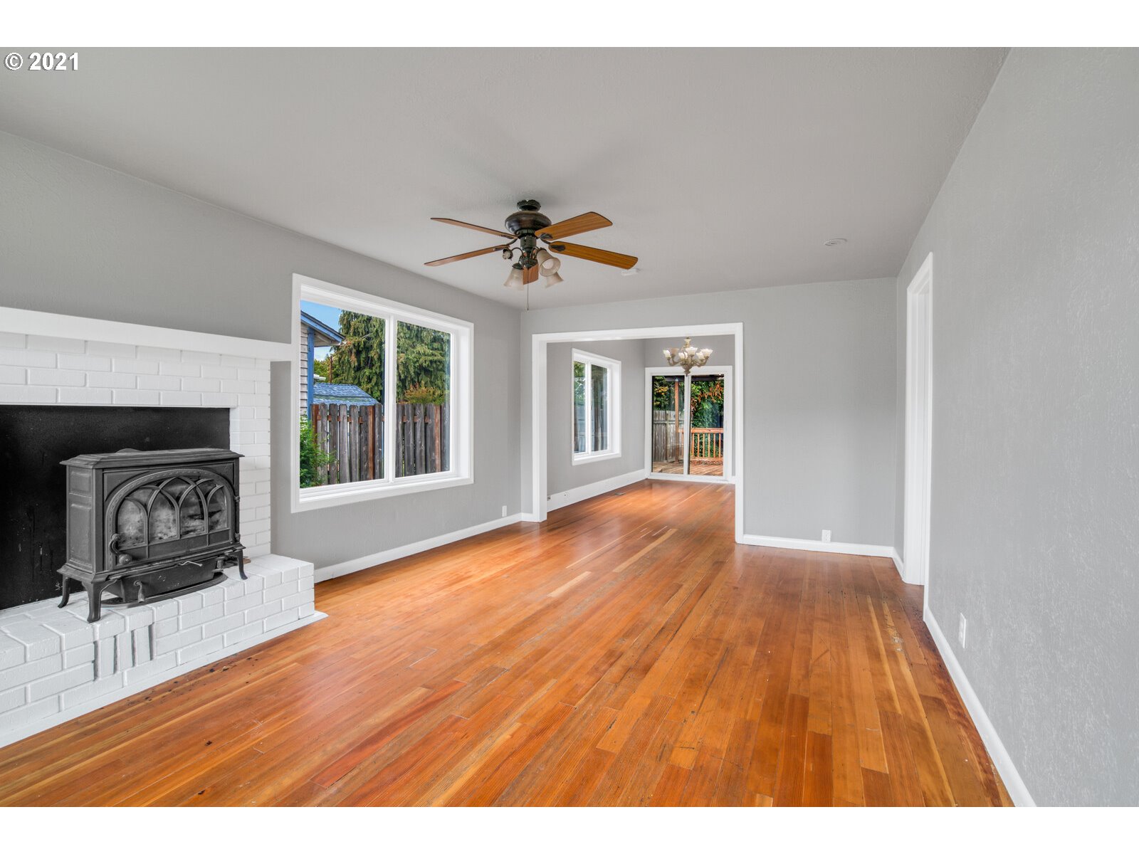1215 2nd Street Northwest Salem, OR 97304 - Photo 6 of 32 a view of livingroom with furniture a ceiling fan and wooden floor
