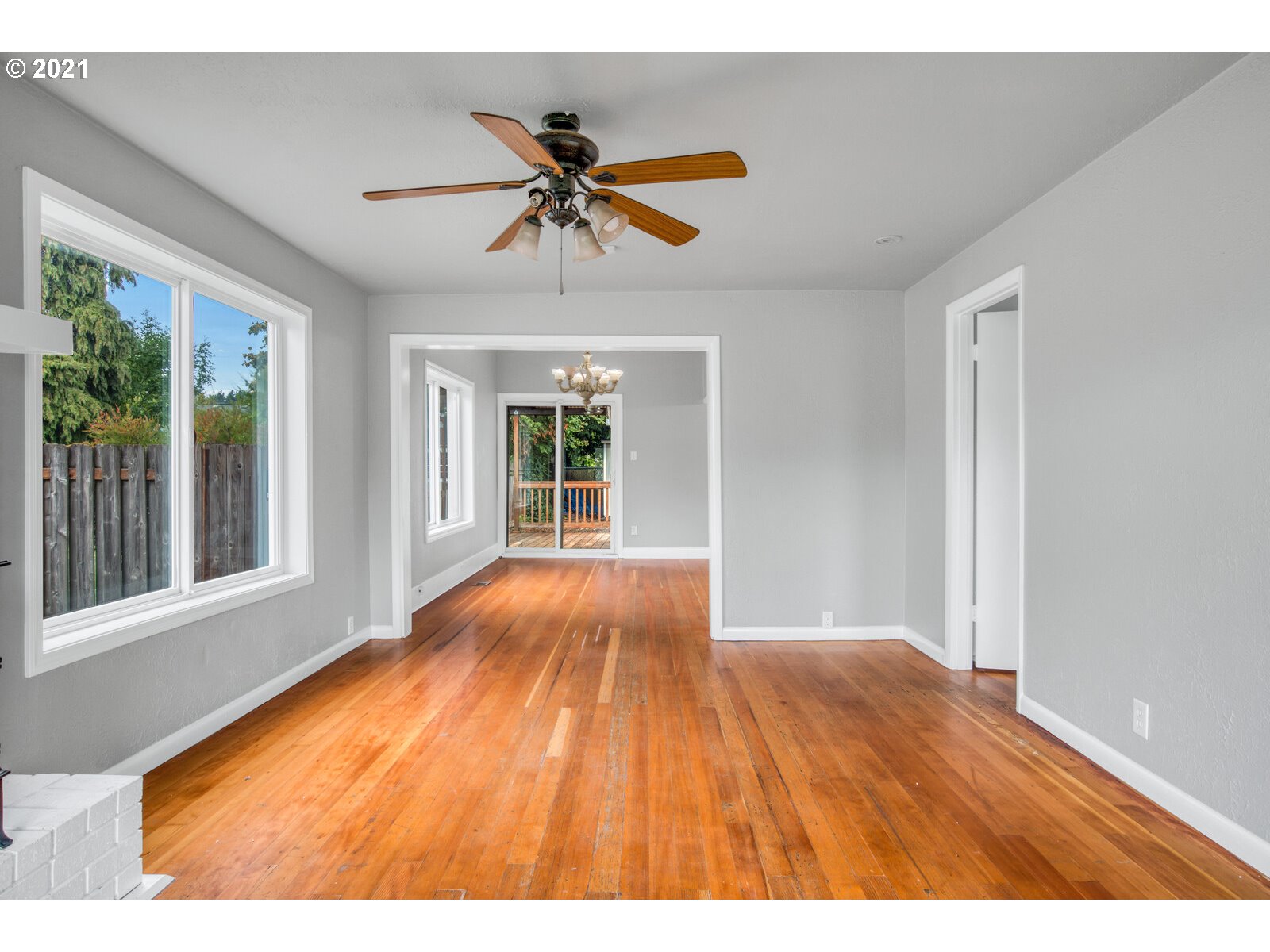 1215 2nd Street Northwest Salem, OR 97304 - Photo 8 of 32 a view of an empty room with wooden floor and a window