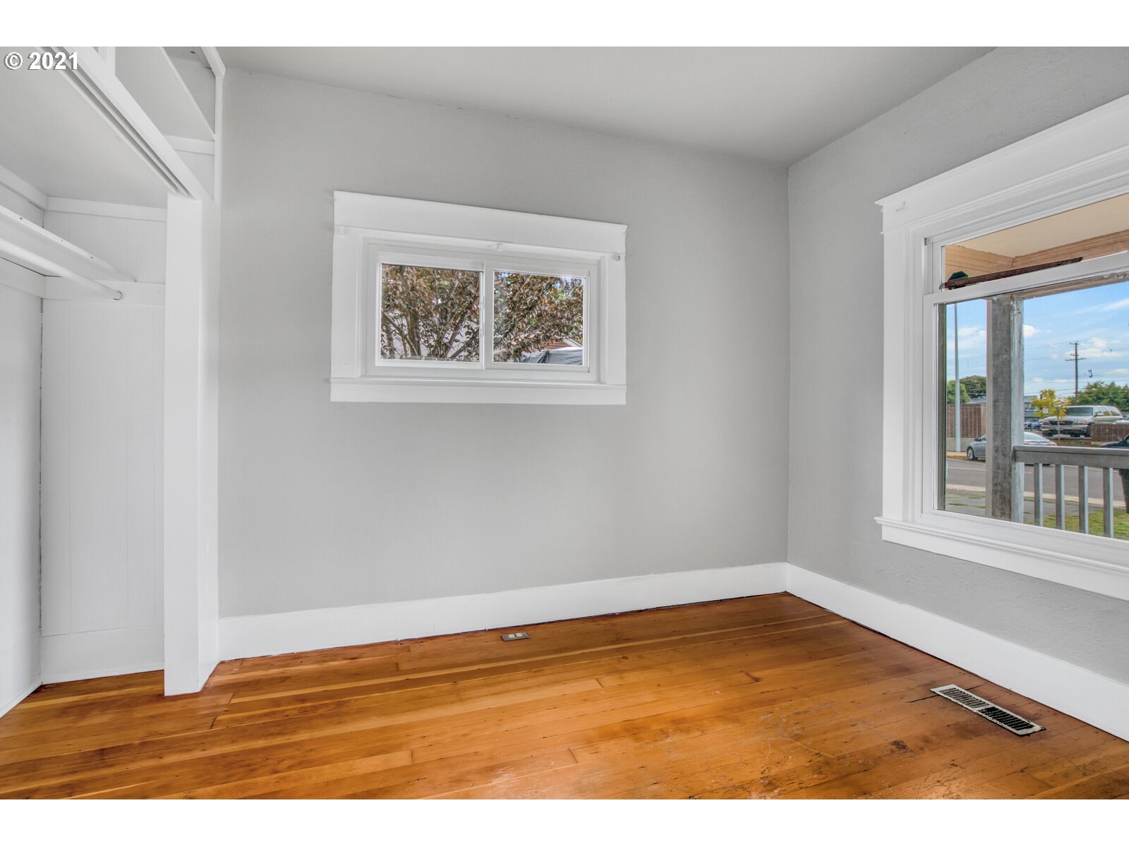 1215 2nd Street Northwest Salem, OR 97304 - Photo 9 of 32 an empty room with wooden floor and windows