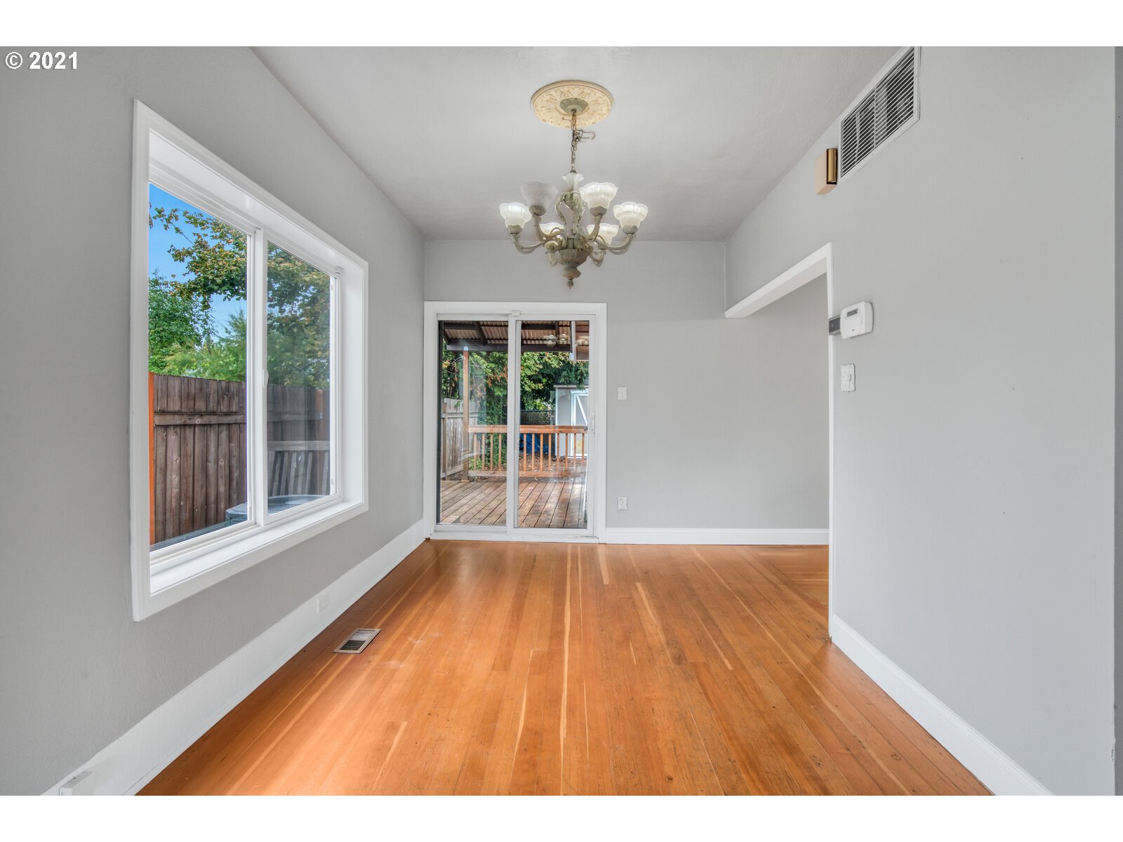 1215 2nd Street Northwest Salem, OR 97304 - Photo 10 of 32 a view of an empty room with wooden floor and a window