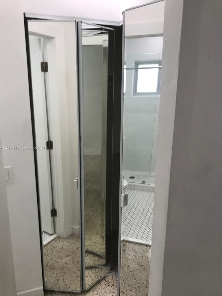 Santa Clara Miami, FL 33127 - Photo 11 of 11 a bathroom with a glass door shower