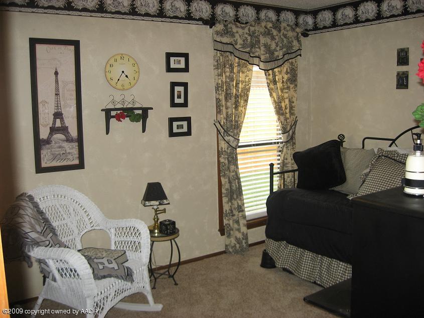 8308 Ranier Drive Amarillo, TX 79110 - Photo 3 of 16 a living room with furniture and a window