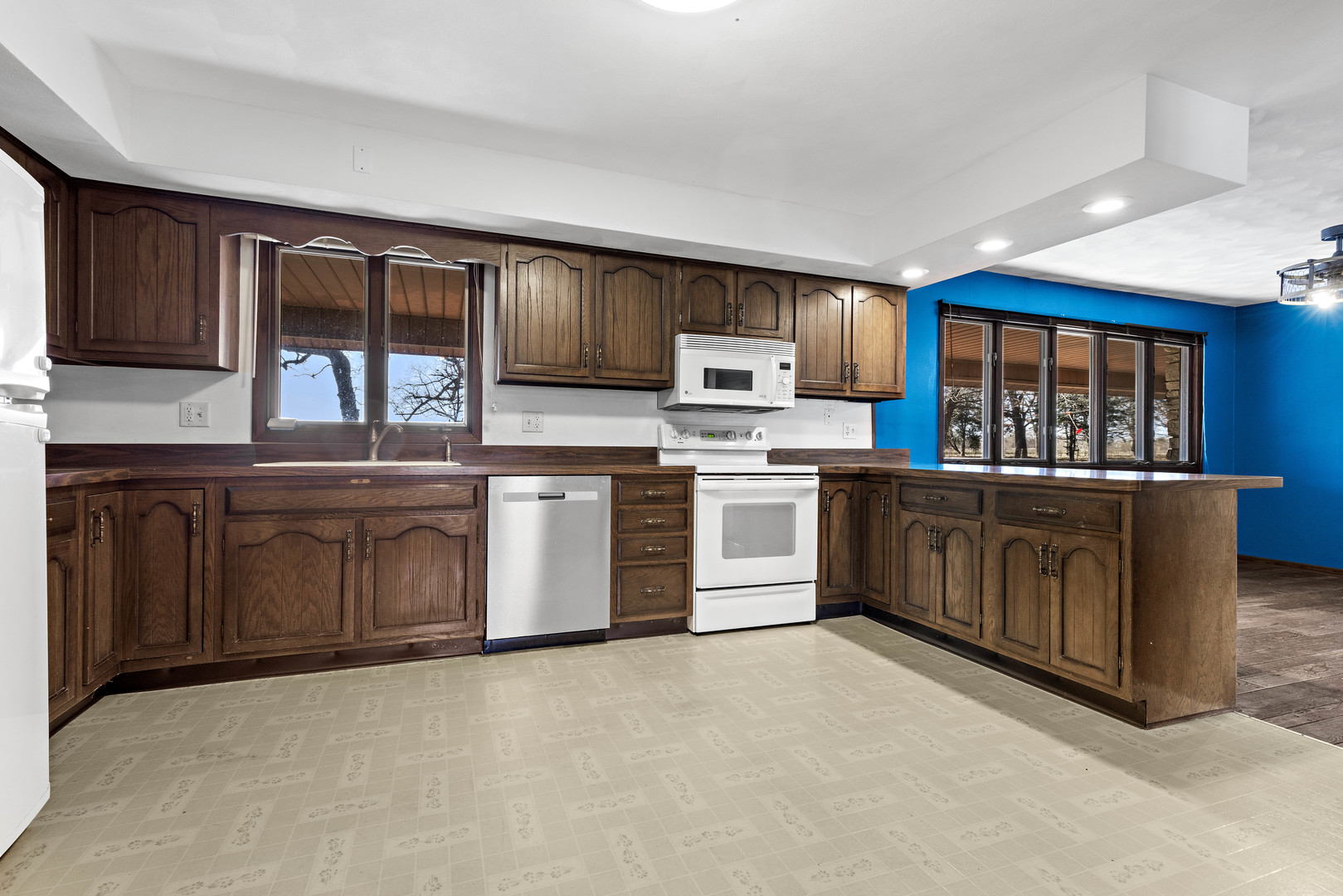 15291 Beaverton Road Poplar Grove, IL 61065 - Photo 9 of 37 a kitchen with a stove top oven sink and cabinets
