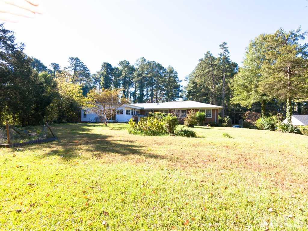 331 Golf Course Drive Raleigh, NC 27610 - Photo 24 of 25 a view of a house with a yard