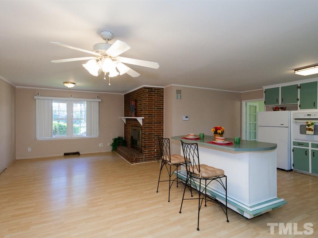 331 Golf Course Drive Raleigh, NC 27610 - Photo 7 of 25 a view of a livingroom with furniture and a ceiling fan