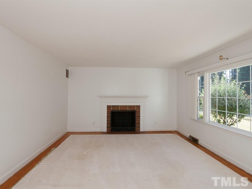 331 Golf Course Drive Raleigh, NC 27610 - Photo 10 of 25 a view of an empty room with a window