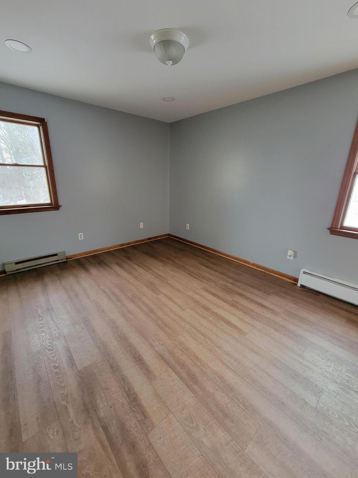 320 Troutman Road Collegeville, PA 19426 - Photo 13 of 21 an empty room with wooden floor and windows