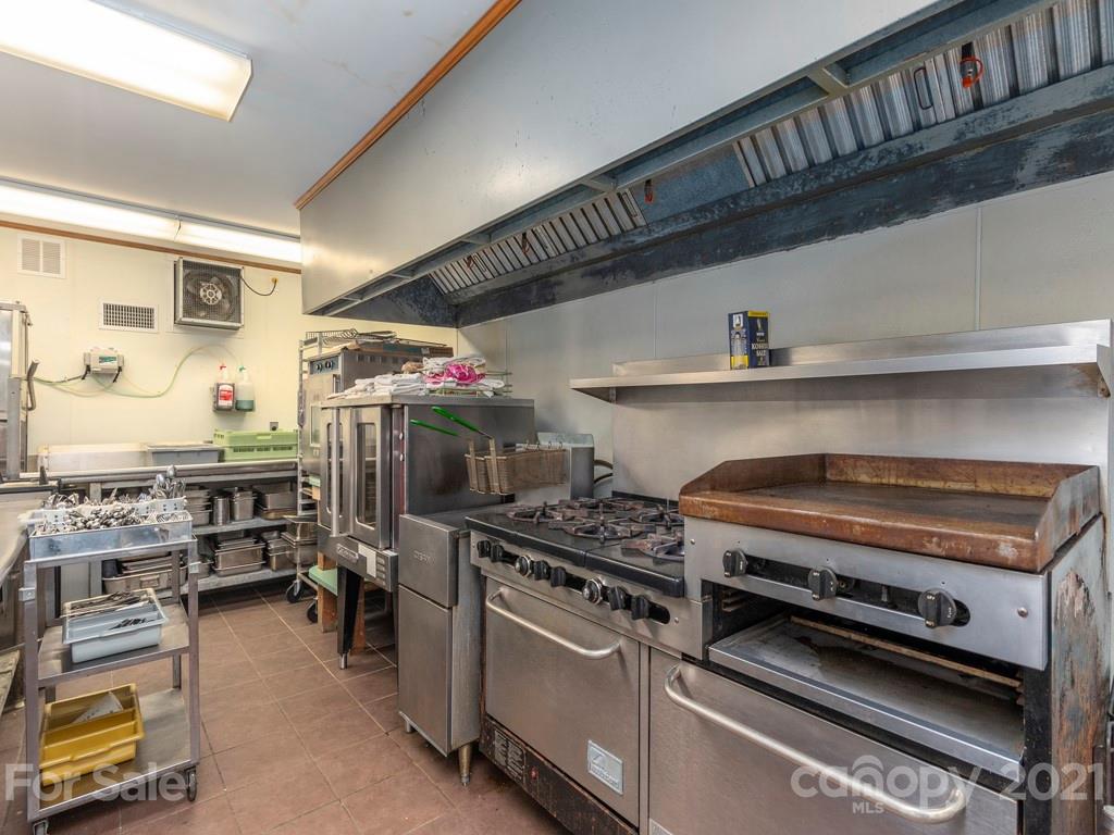 566 Walker Road Waynesville, NC 28786 - Photo 13 of 28 a kitchen with a stove and a cabinets