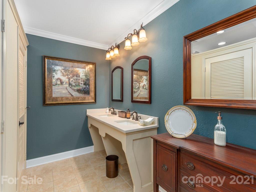 566 Walker Road Waynesville, NC 28786 - Photo 16 of 28 a bathroom with a sink mirror and vanity