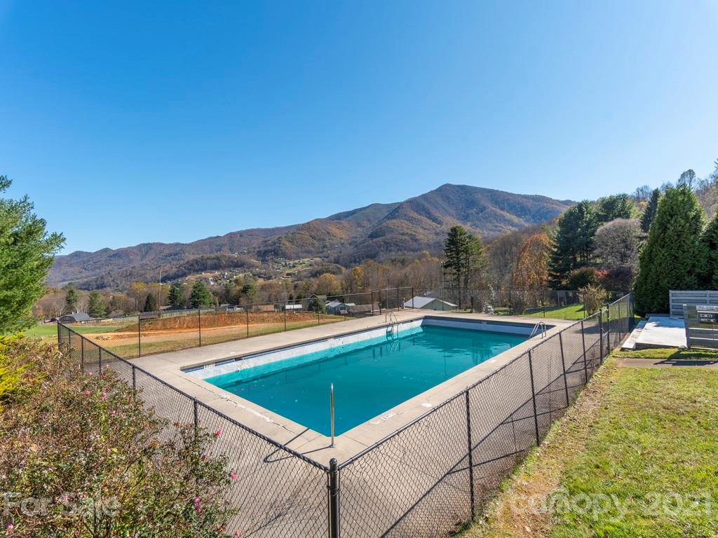 566 Walker Road Waynesville, NC 28786 - Photo 23 of 28 a view of swimming pool with a lounge chair