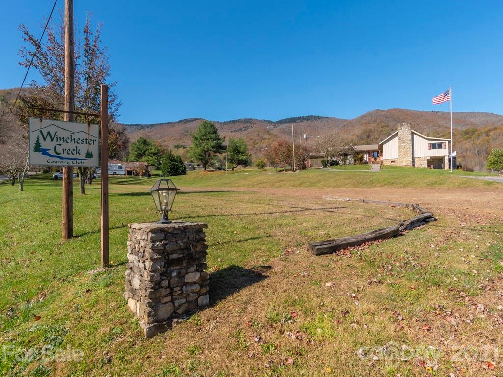 566 Walker Road Waynesville, NC 28786 - Photo 25 of 28 a view of a house with a yard